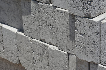 a close up of a brick wall made of cement